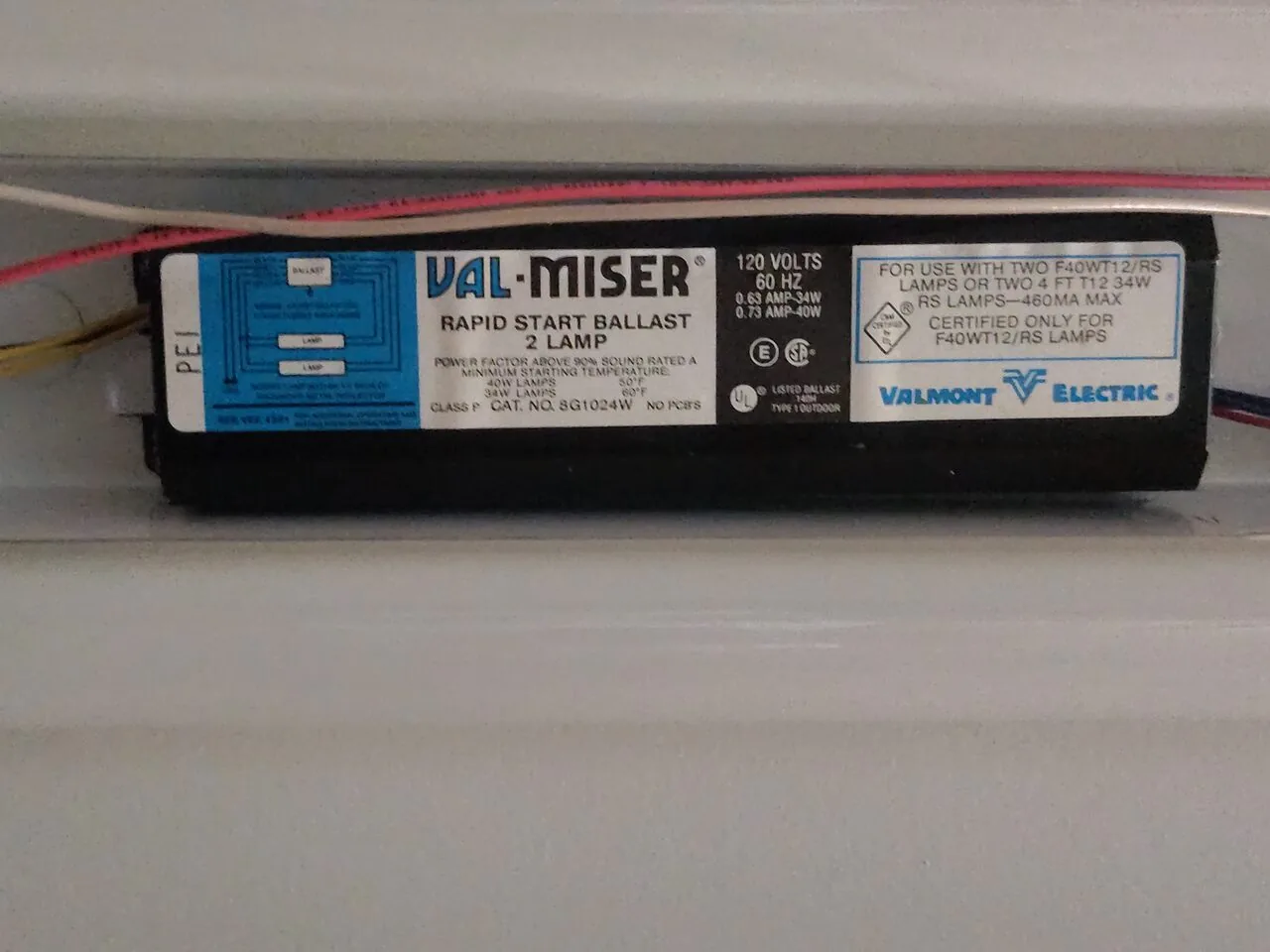 Replacement two-lamp fluorescent ballast wired into a ceiling light fixture
