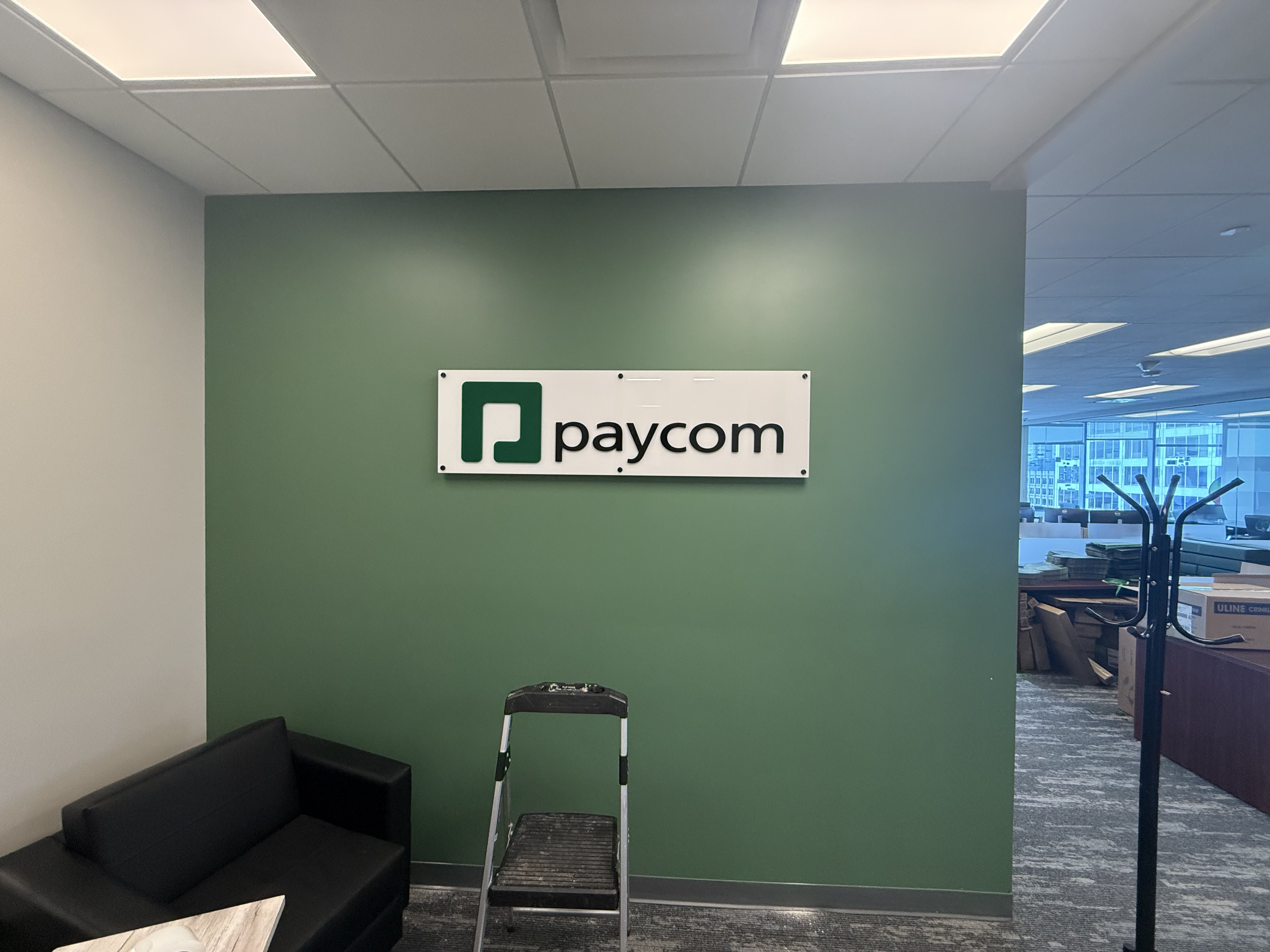 Commercial business sign mounted on wall by North Shore Fixers Milwaukee