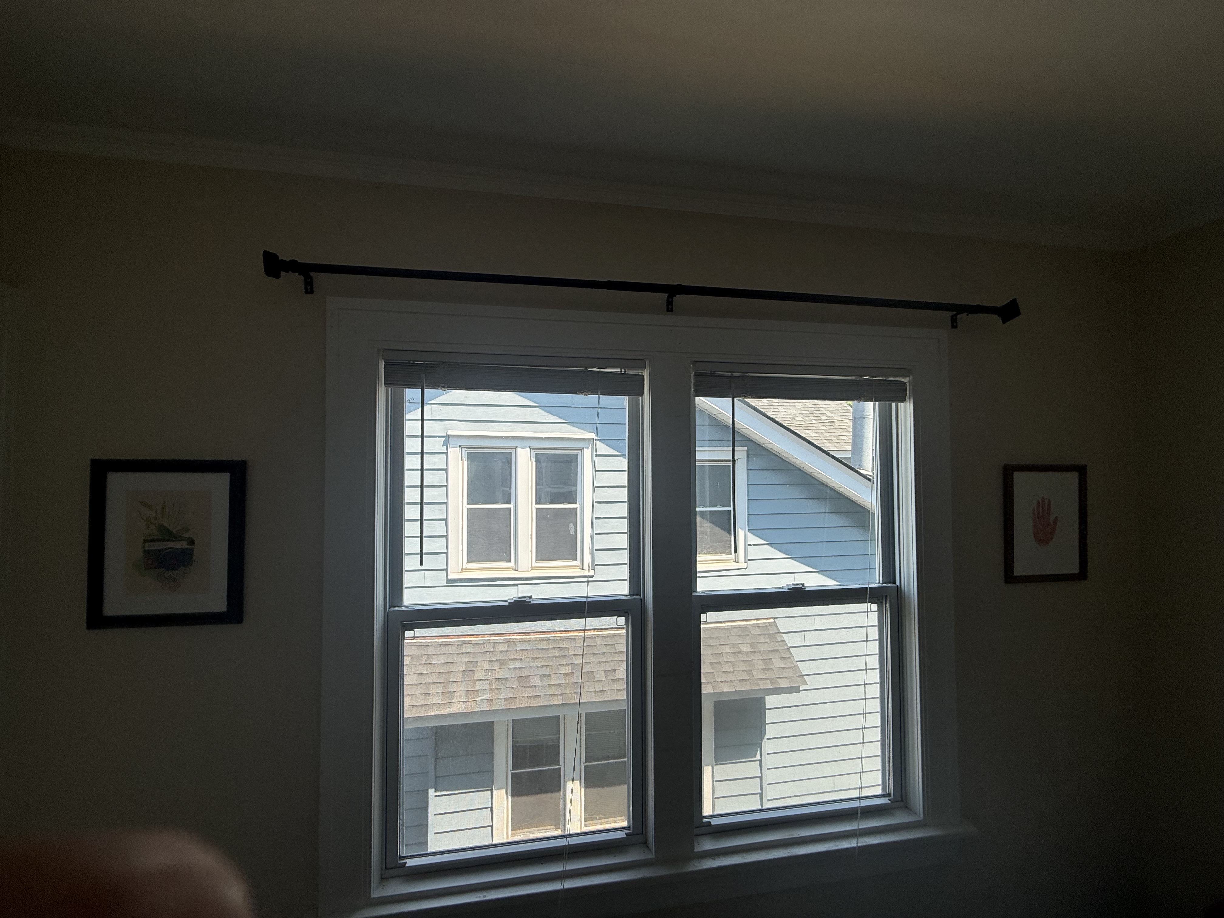 Curtain rod installed above bedroom windows by North Shore Fixers Milwaukee