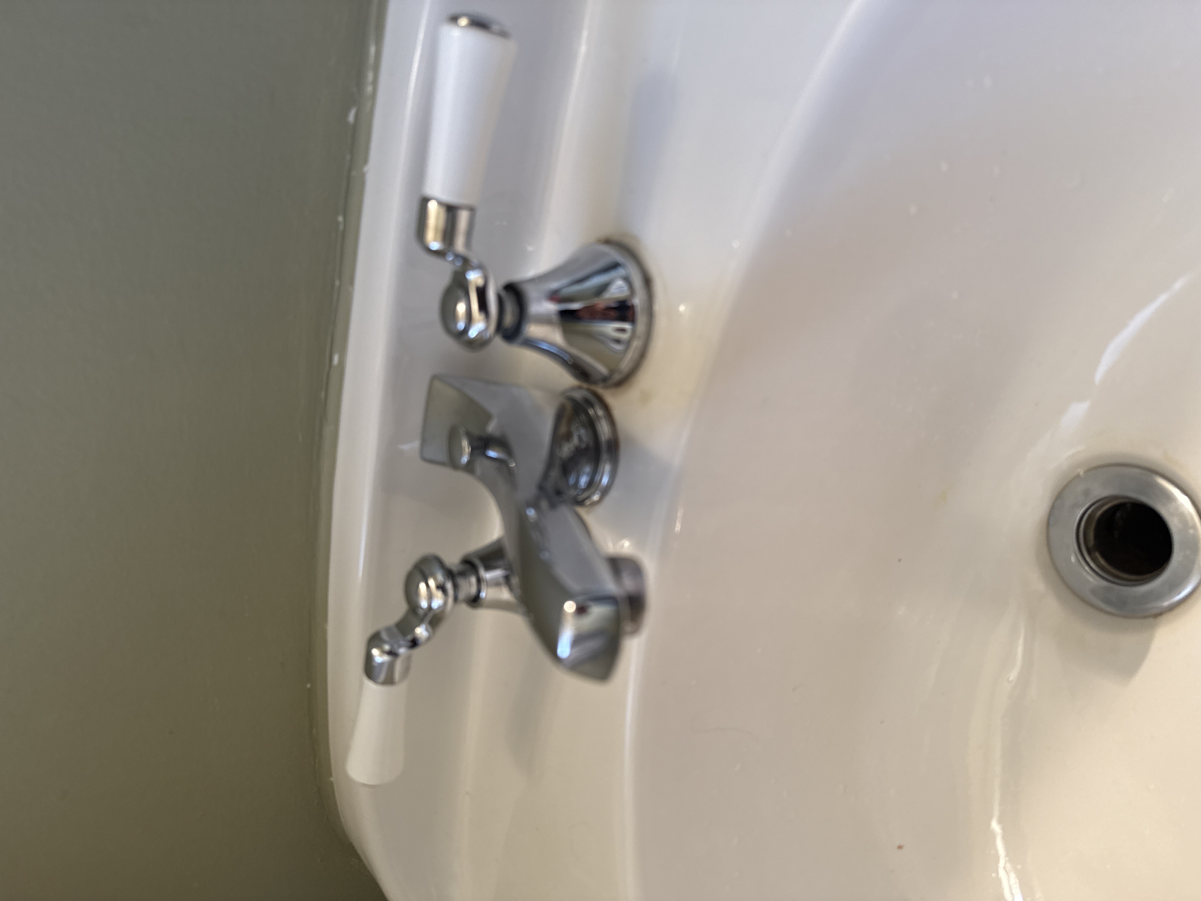 Chrome faucet installation on bathroom sink by North Shore Fixers Milwaukee