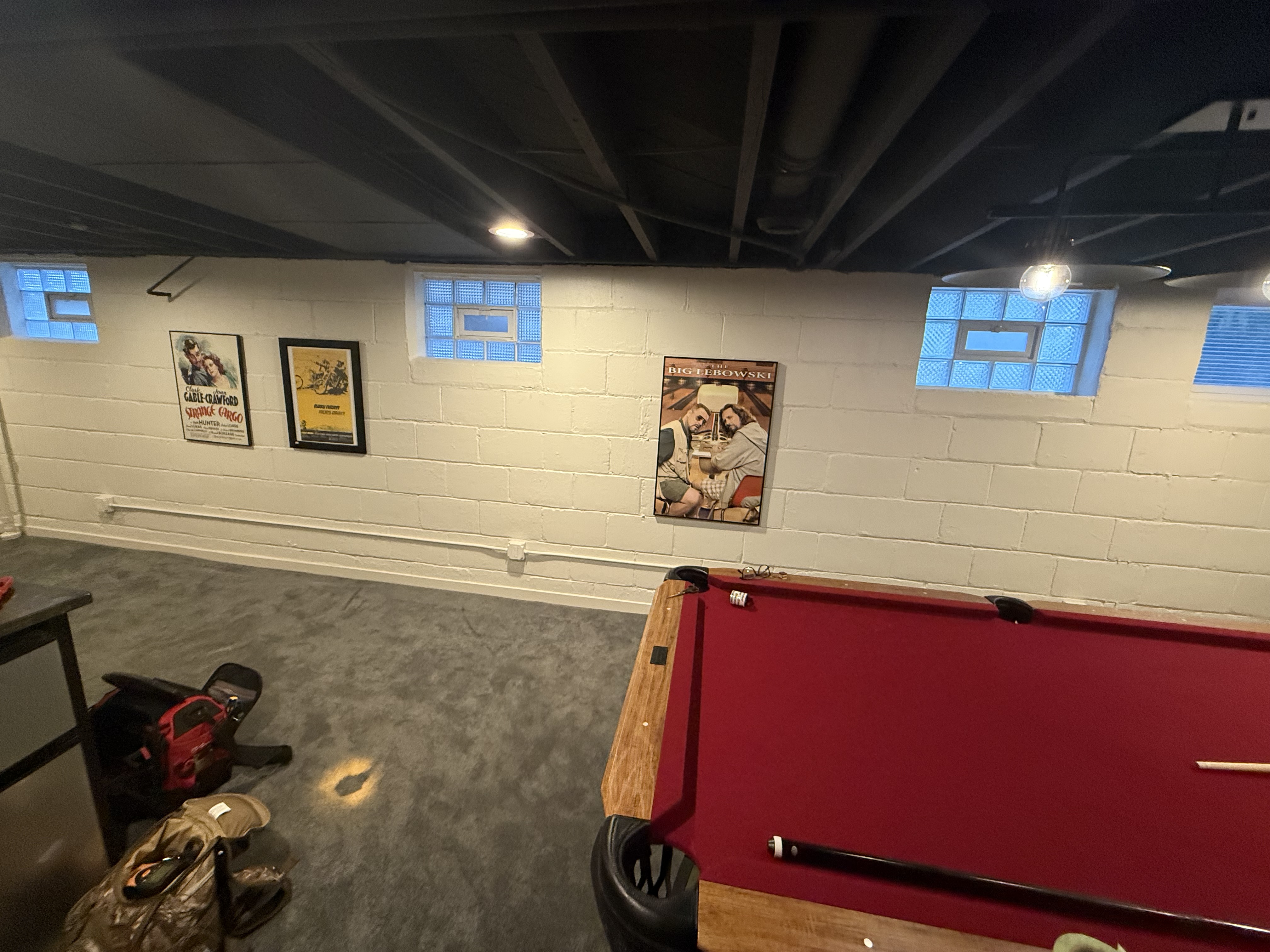 Movie poster gallery wall hung in basement game room by North Shore Fixers Milwaukee